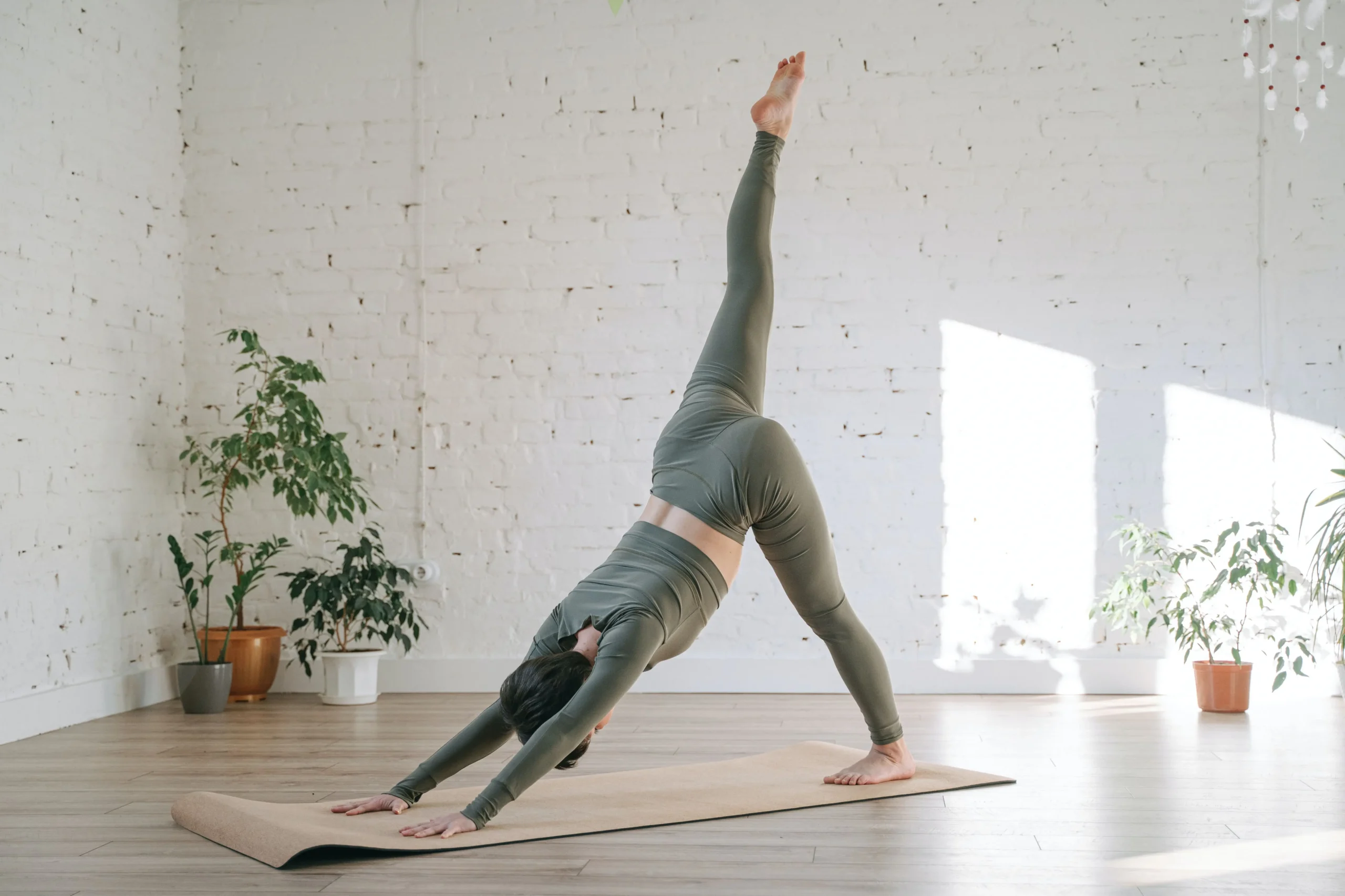 Girl does yoga in a fitness center in an airport