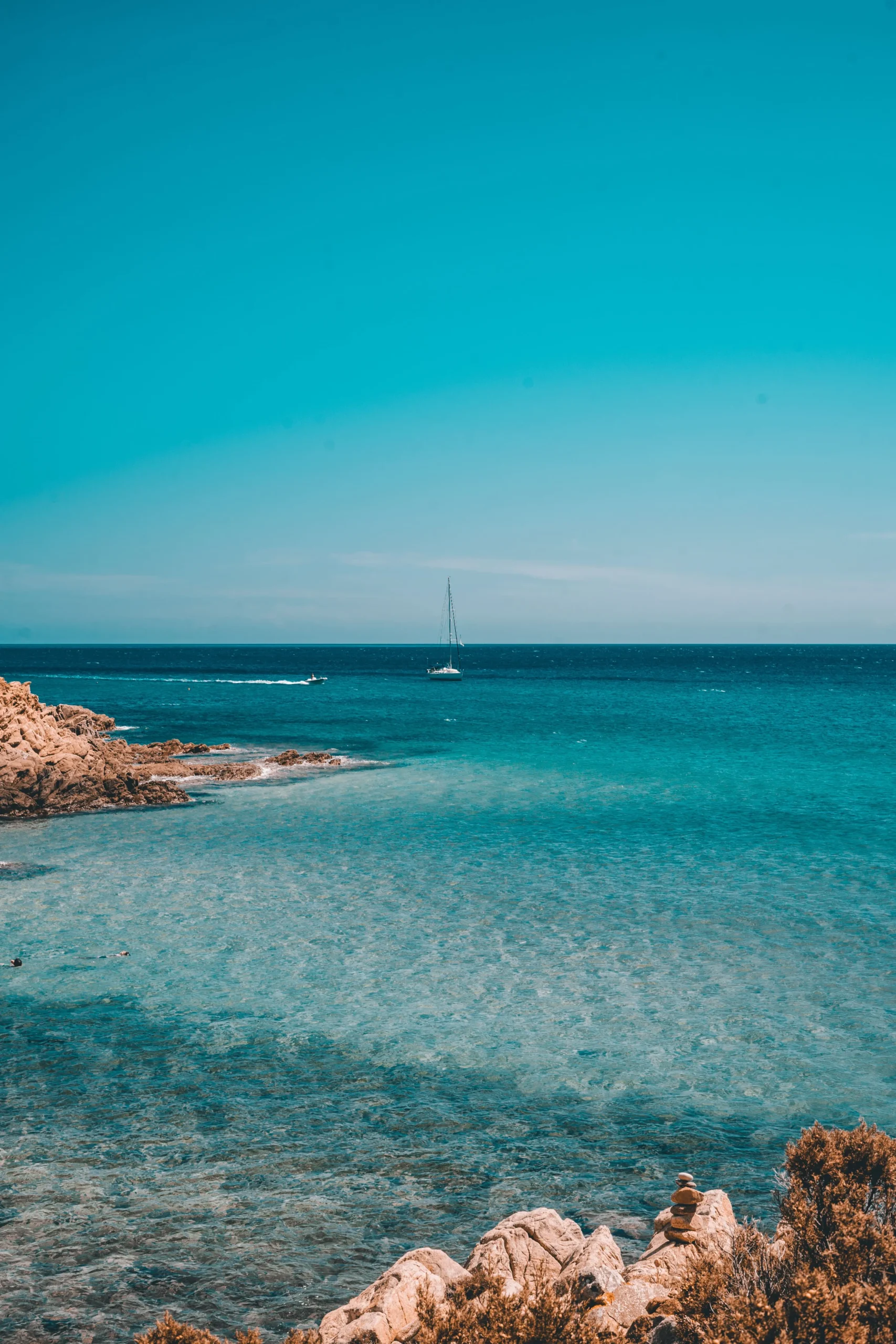 View of a magnificent Cagliari beach. You can see the rocks and the deep blue water.