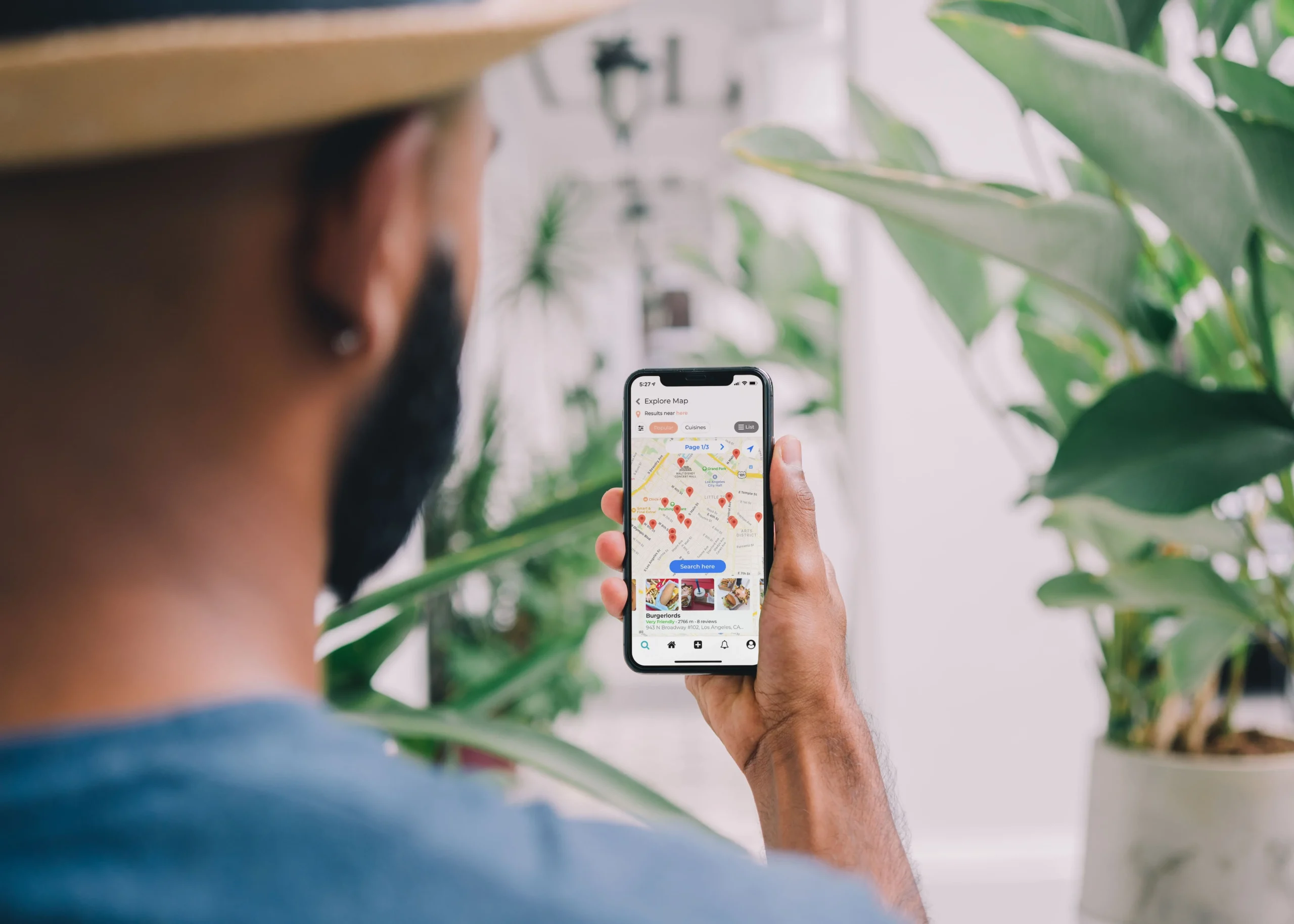 A boy on the road uses a map app to get his way around